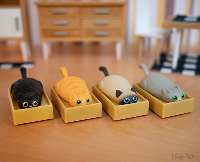 Racing Cats in Boxes